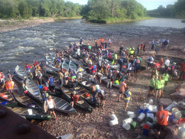 Crowd on the river for Project AWARE